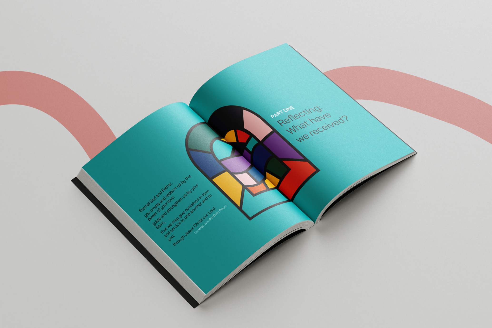 Open brochure with colourful stained glass window image and text.