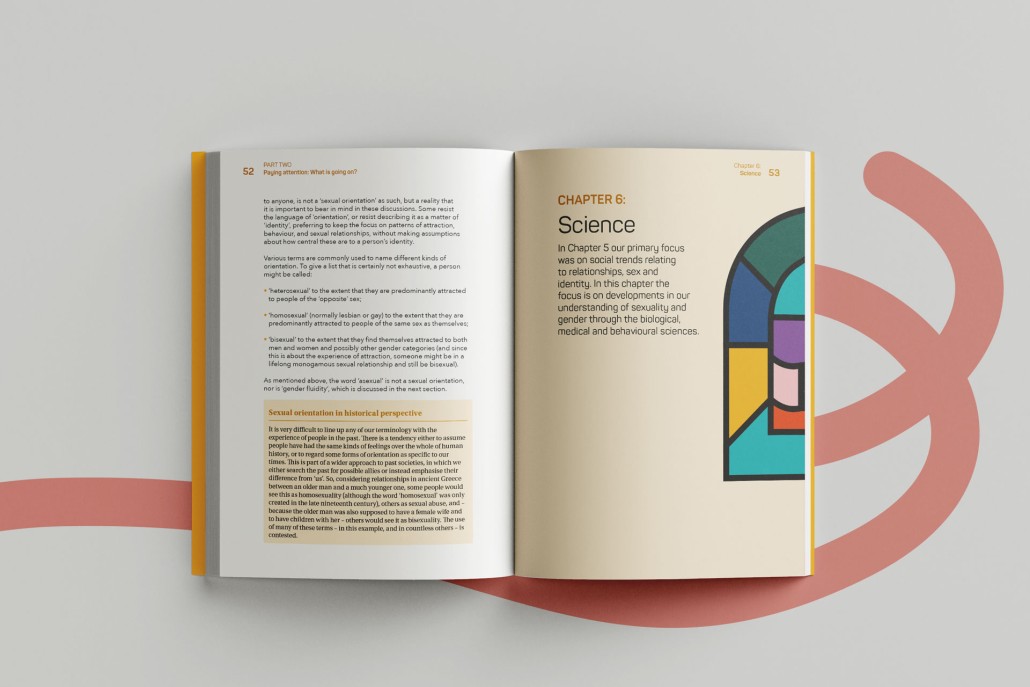 Open brochure with colourful stained glass window image and text.