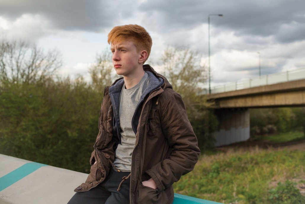 boy sitting outside