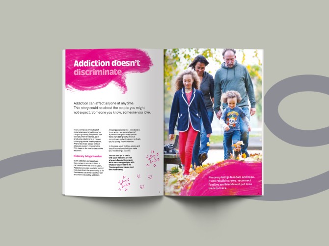 Open brochure with colourful spread with an image of a family, mum, dad and two children.