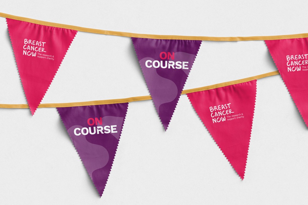 Image of pink and purple bunting for Breast Cancer Now golf event.