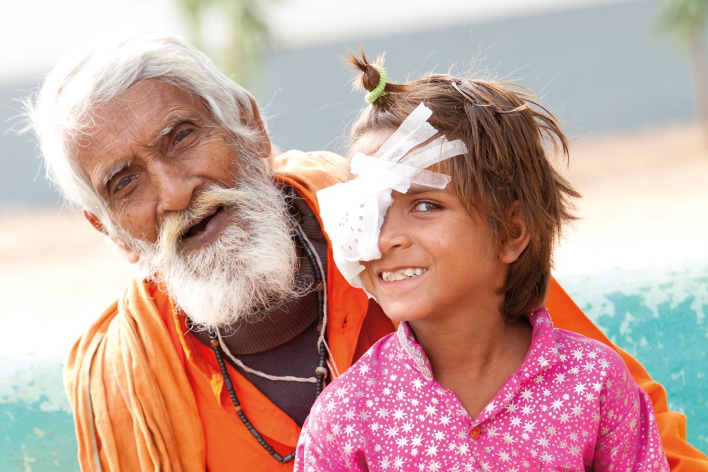 image of man and child with eye patch