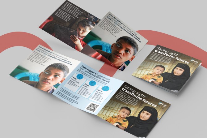 An open leaflet with text and images of a family from Bangladesh